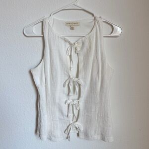 Cream Sleeveless Blouse with bow Accents